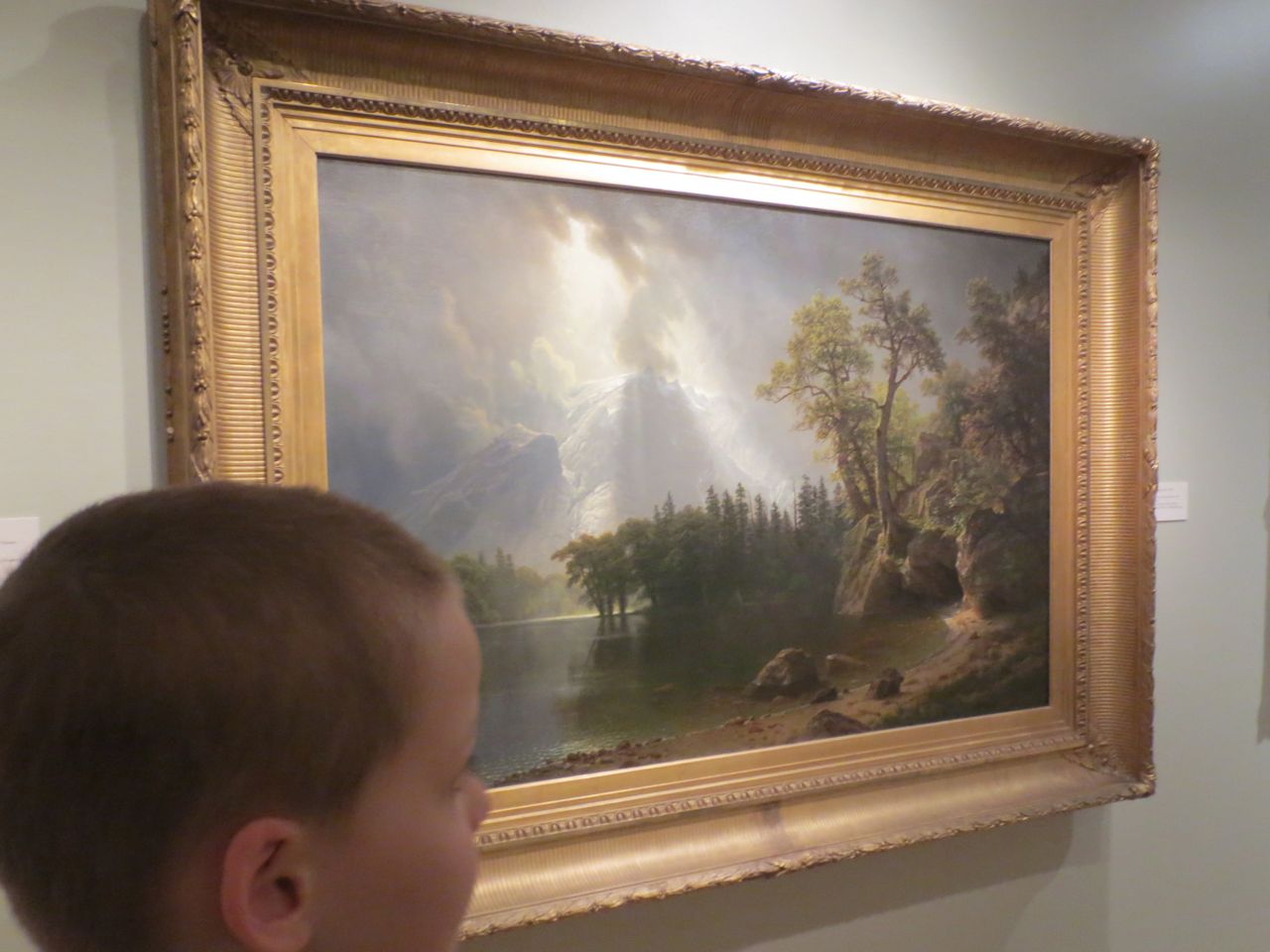 F.T. looking at Albert Bierstadt's "Passing Storm over the Sierra Nevadas" (1870) at San Antonio Museum of Art | San Antonio Charter Moms