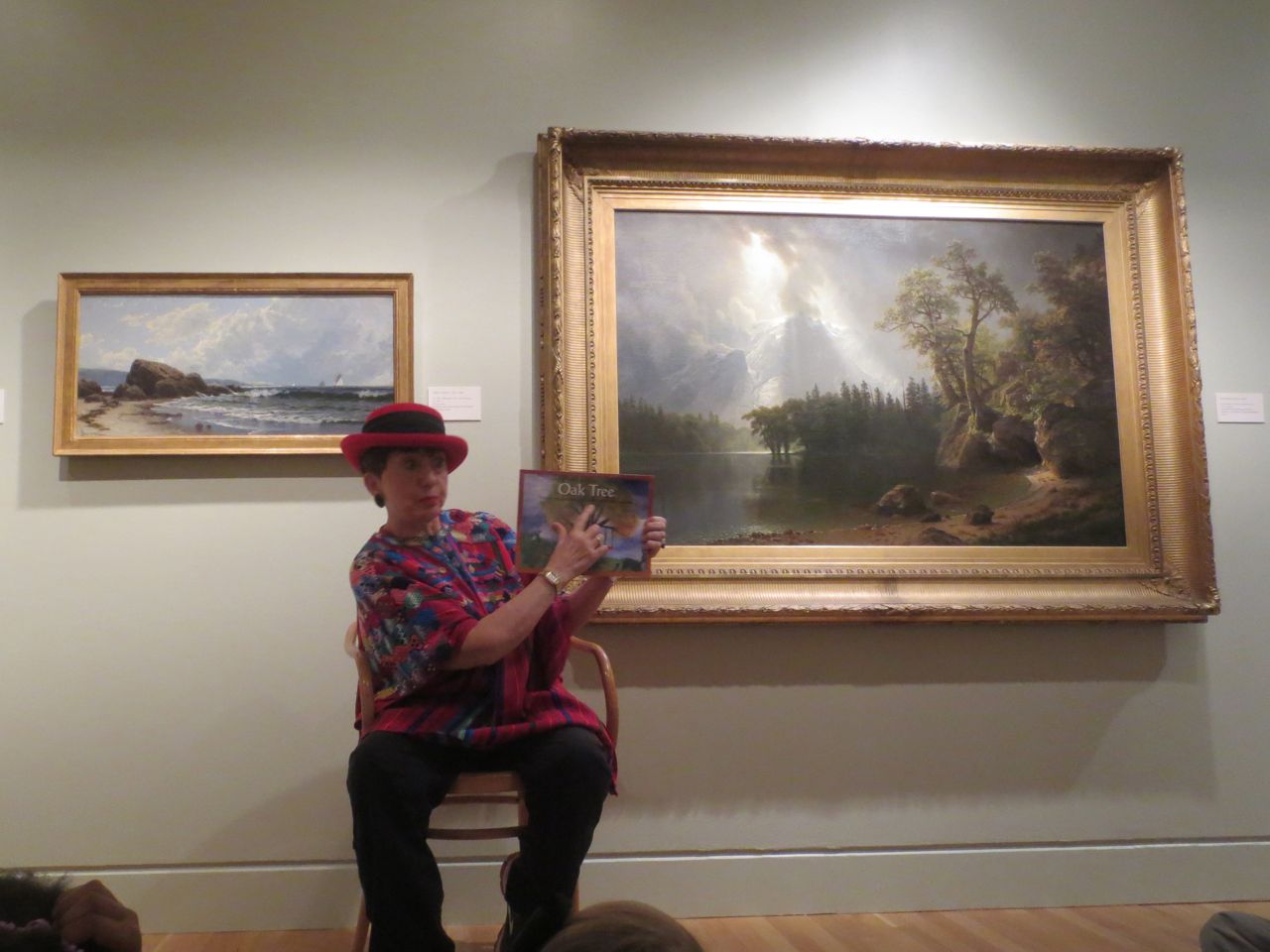 Melody Rose Mollis Lundquist reading her book "Oak Tree" in the American gallery at the San Antonio Museum of Art | San Antonio Charter Moms