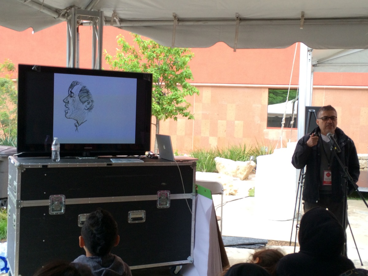 Joe Cepeda with sketch of Cesar Chavez - San Antonio Book Festival | San Antonio Charter Moms