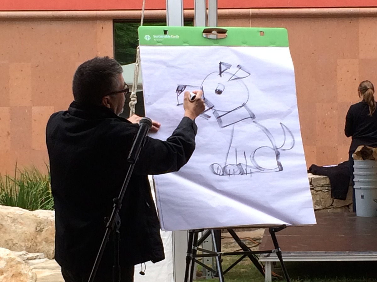 Joe Cepeda sketching a dog at the San Antonio Book Festival | San Antonio Charter Moms