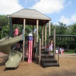 Patriotic playground decorations at the Monte Vista Historical Association 4th of July picnic | San Antonio Charter Moms