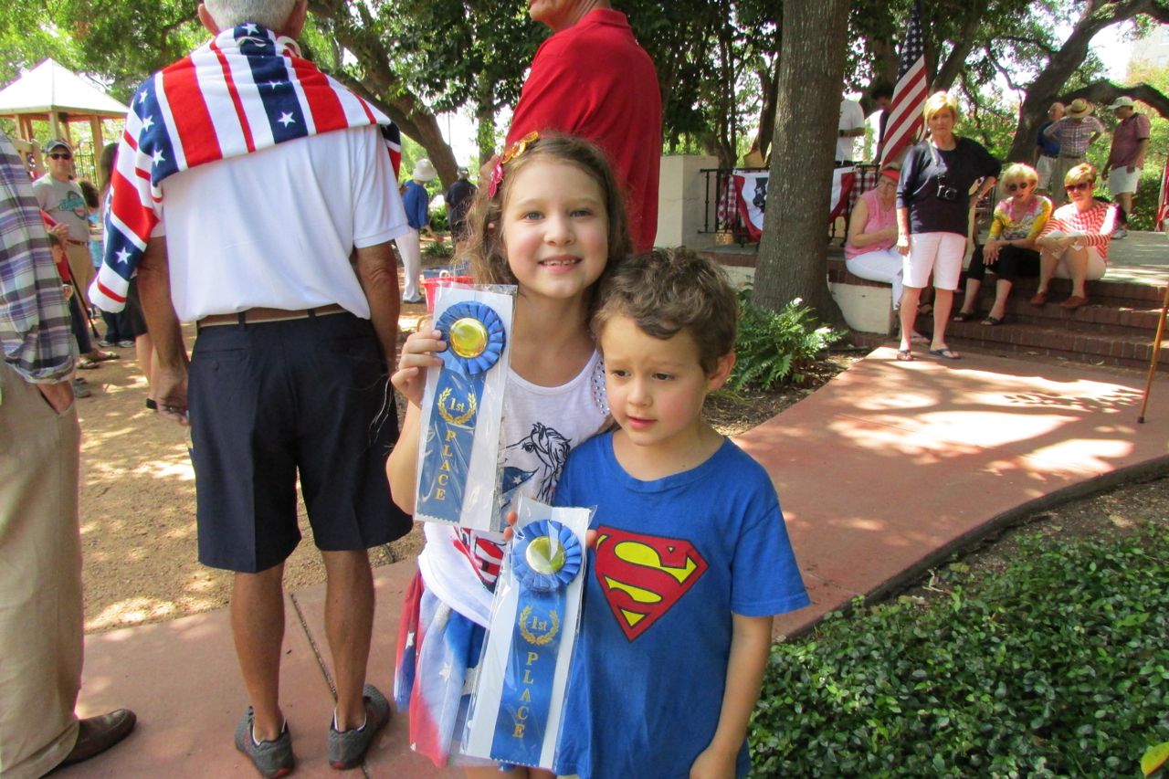 Sophia and Lucas Rico with first place ribbons for best decorated bikes at the Monte Vista Historical Association 4th of July parade and picnic | San Antonio Charter Moms
