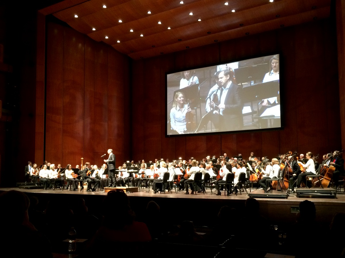 Sebastian Lang-Lessing addressing the audience at a San Antonio Symphony DISCOVER Series concert in the H-E-B Performance Hall of the Tobin Center for the Performing Arts | San Antonio Charter Moms