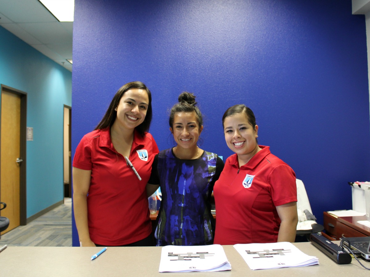 Nancy Cruz, Lynzee Villafranca, and Maria Martinez welcome new families at Meet the Teacher Night at Compass Rose Academy public charter school in San Antonio, Texas | San Antonio Charter Moms