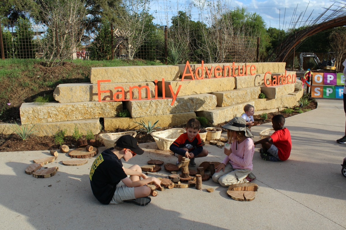 Children playing with natural wood blocks at the Family Adventure Garden at the San Antonio Botanical Garden | San Antonio Charter Moms