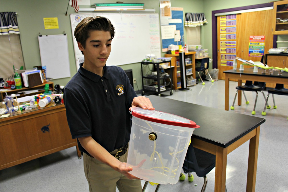 BFSMS student Caden with dry ice apparatus in middle school science classroom | San Antonio Charter Moms