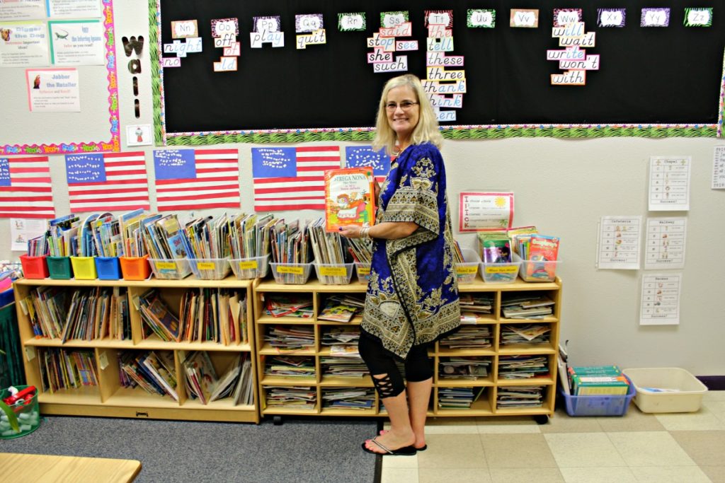 BFSMS first grade teacher Julee Evans with books in her classroom | San Antonio Charter Moms