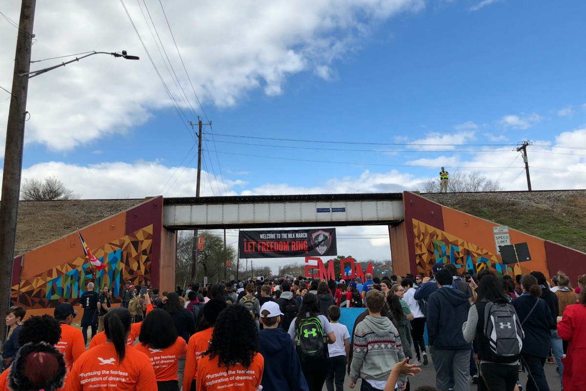 Dream and Peace murals at the railroad bridge at the MLK March | San Antonio Charter Moms