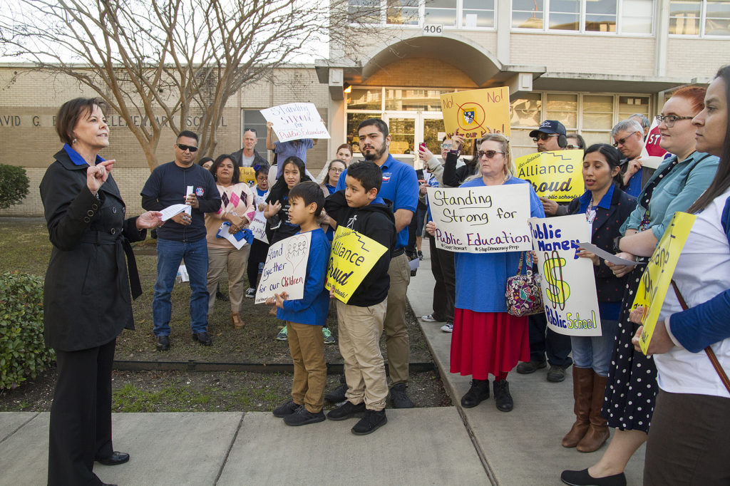 San Antonio Alliance of Teachers and Support Personnel President Shelly Potter addresses members of the San Antonio Alliance of Teachers Support and Personnel, Stewart Elementary parents and staff at a rally outside Burnet Elementary before the school board votes on whether to move forward with a partnership between Stewart Elementary School and Democracy Prep Public Schools, Monday, Jan. 22, 2018.
