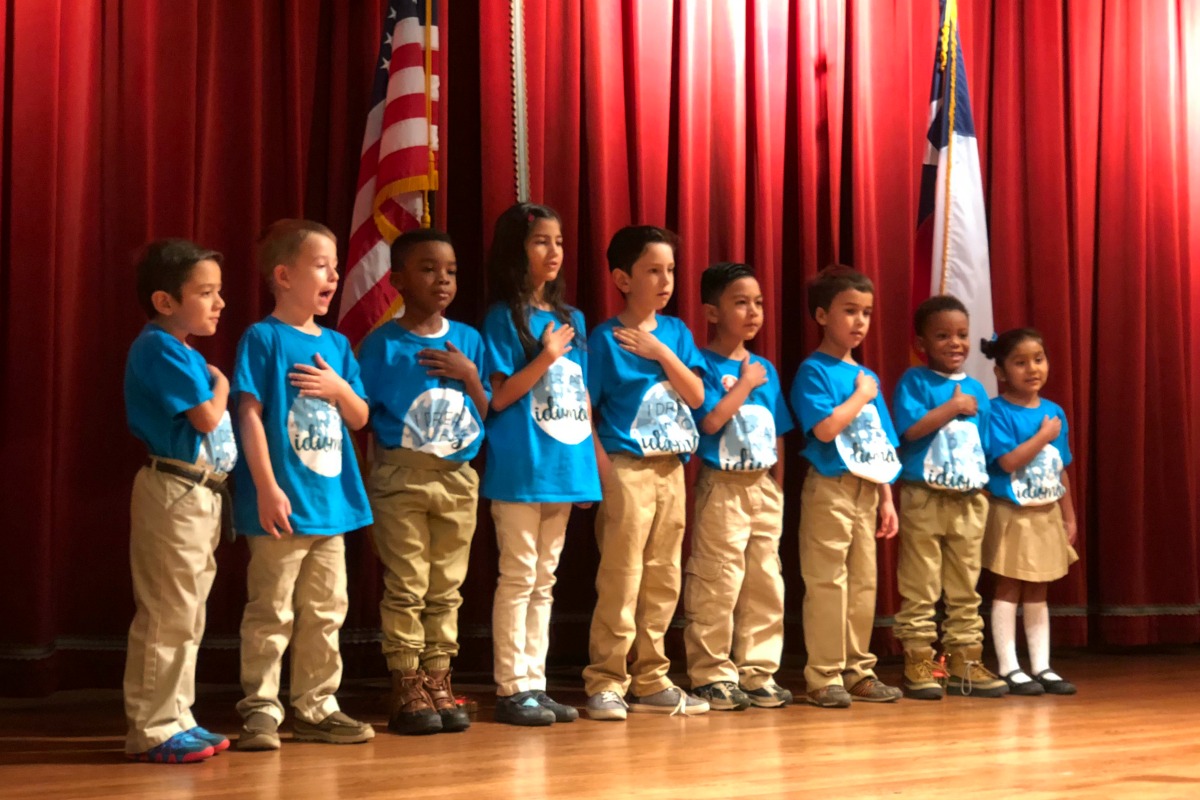 Twain Dual Language Academy students reciting the Pledge of Allegiance at the San Antonio ISD State of the District address | San Antonio Charter Moms