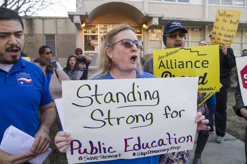 Shannon Elledge, a teacher at SAISD and a member of the San Antonio Alliance of Teachers Support and Personnel participates in a rally outside Burnet Elementary before the school board votes on whether to move forward with a partnership between Stewart Elementary School and Democracy Prep Public Schools, Monday, Jan. 22, 2018. | San Antonio Charter Moms