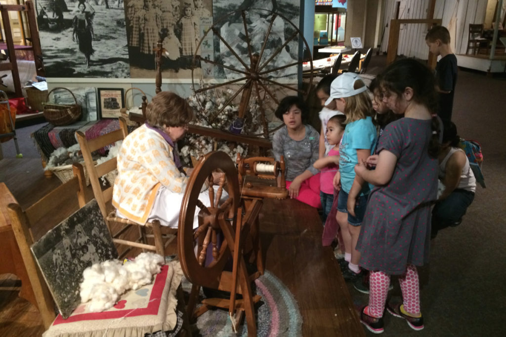San Antonio History Museum Reciprocal Membership Benefits - Spinning demonstration at the Institute of Texan Cultures | San Antonio Charter Moms
