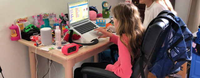 girl coding on a laptop with her mother and toys learn everywhere