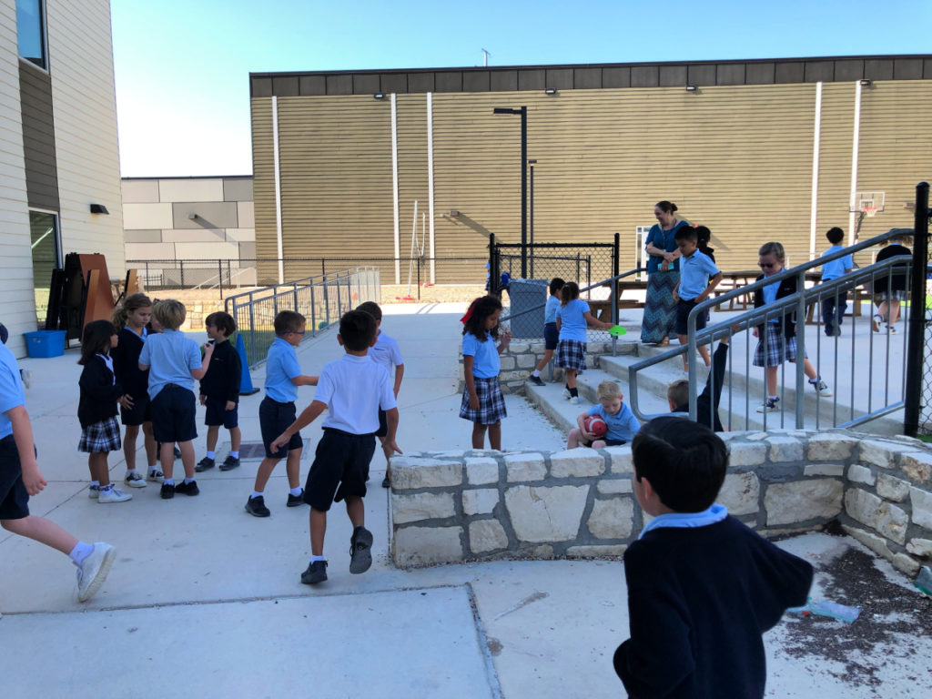 students playing outside at San Antonio school in 2019