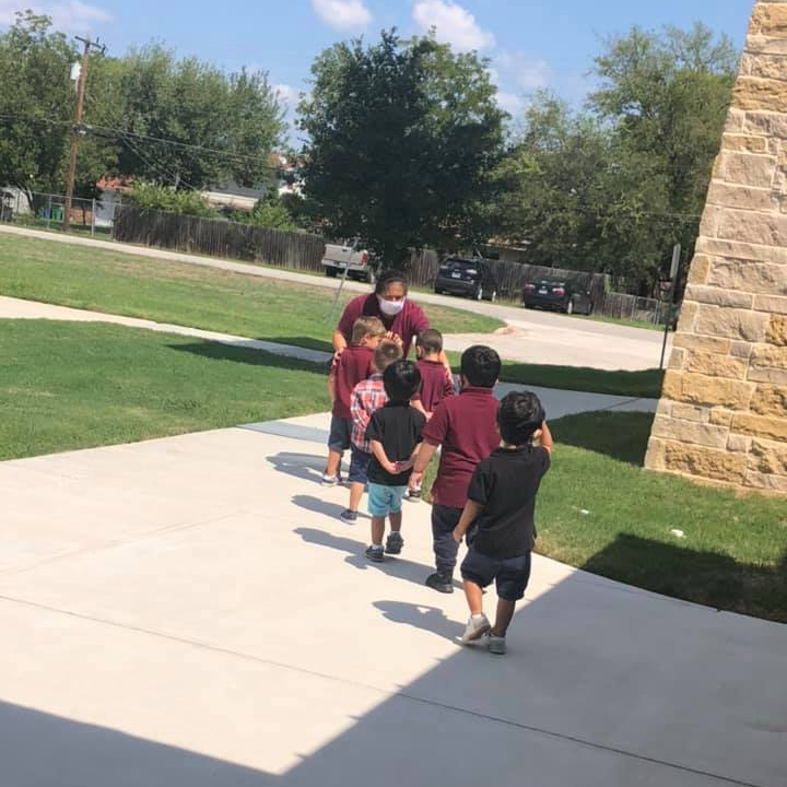 Lighthouse Public Schools elementary students walking in a line