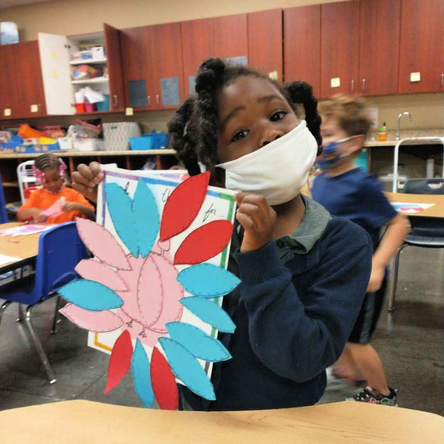 elementary student at Jubilee Academies making a turkey craft