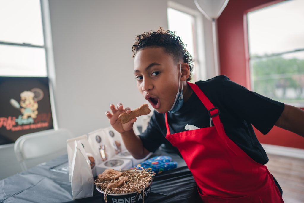 Boy pretending to eat at entrepreneurship camp