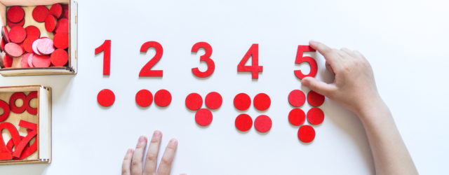 child's hands using red math manipulitives | learning style myth