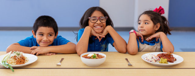 IDEA Public Schools Child Nutrition Program Cookbook three students