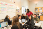 Somerset Academy Collegiate principal Coach Monique Almazan with students