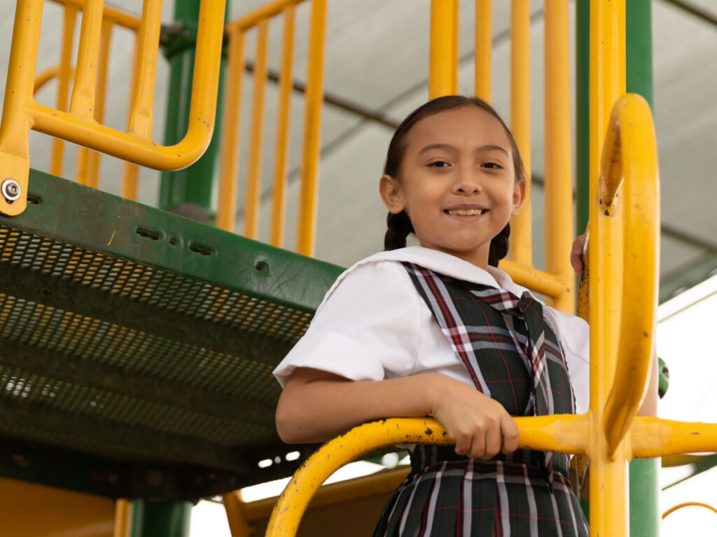 San Antonio Catholic Schools girl student playground horizontal